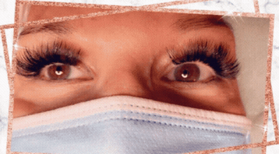 A Close Up Of A Woman 'S Eyes With A Mask On GIF