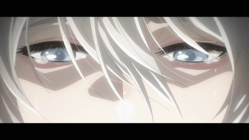 A Close Up Of A Woman 'S Eyes With White Hair GIF