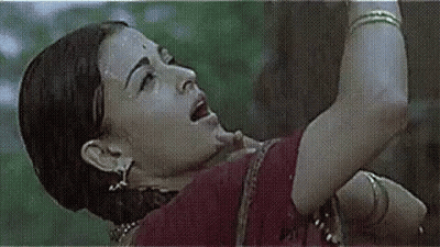 A Close Up Of A Woman 'S Face And Arm With A Grid Pattern . GIF