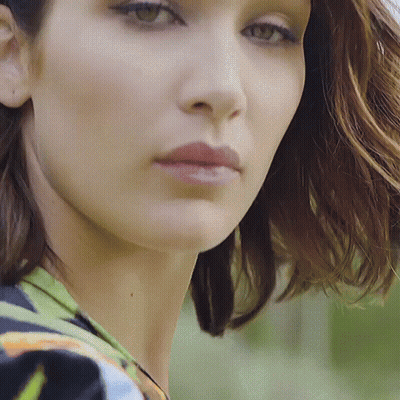A Close Up Of A Woman 'S Face And Neck GIF