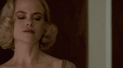 A Close Up Of A Woman 'S Face And Neck GIF