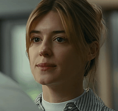 A Close Up Of A Woman 'S Face And Neck GIF