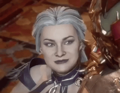 A Close Up Of A Woman 'S Face In A Video Game With Blue Hair And Purple Lipstick . GIF