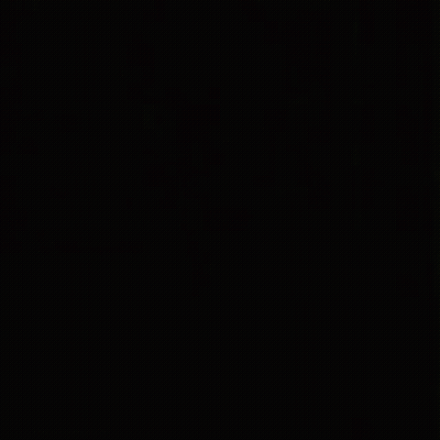A Close Up Of A Woman 'S Face In The Dark . GIF