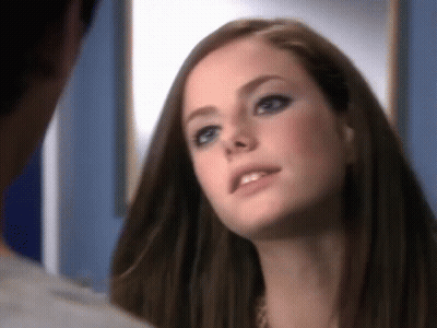 A Close Up Of A Woman 'S Face Looking At A Man GIF