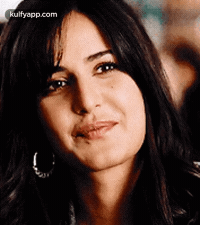 A Close Up Of A Woman 'S Face Making A Funny Face . GIF
