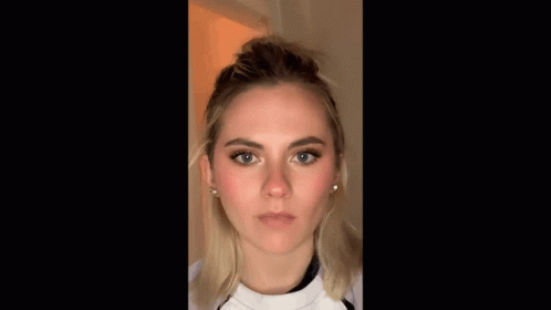 A Close Up Of A Woman 'S Face Making A Funny Face GIF