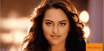 A Close Up Of A Woman 'S Face Next To A Sign That Says ' Shilpa Jalli ' On It GIF