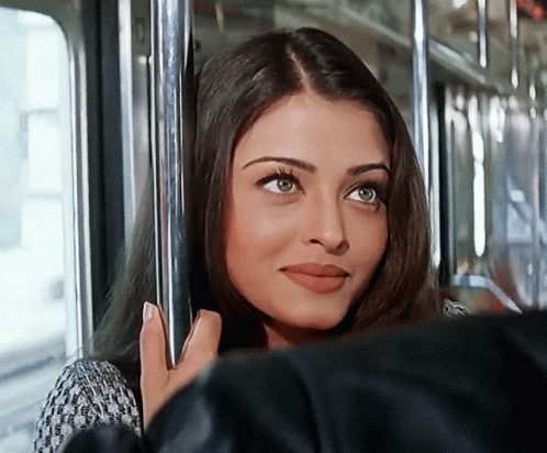A Close Up Of A Woman 'S Face On A Train GIF