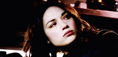 A Close Up Of A Woman 'S Face Smiling GIF