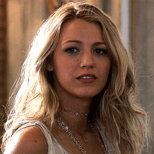 A Close Up Of A Woman 'S Face Wearing A Choker And A Tank Top GIF