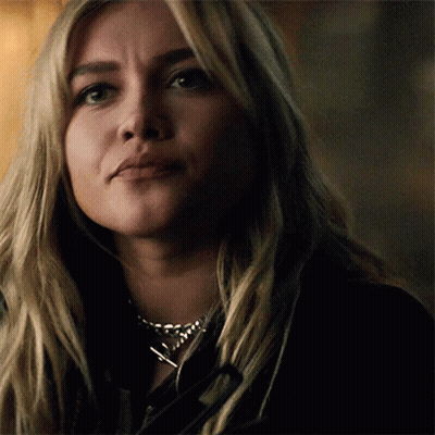 A Close Up Of A Woman 'S Face Wearing A Necklace . GIF