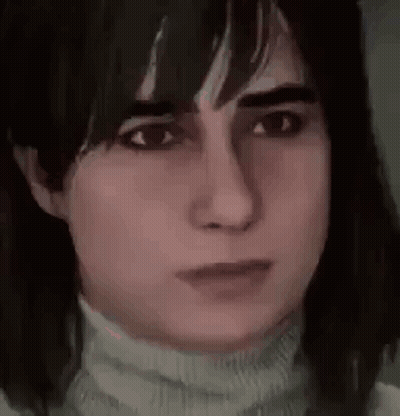 A Close Up Of A Woman 'S Face Wearing A Turtleneck And Looking At The Camera . GIF