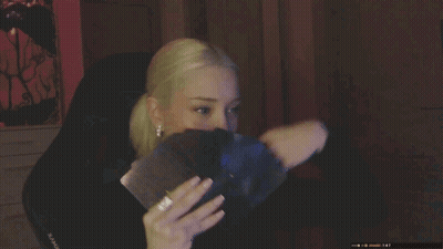 A Close Up Of A Woman 'S Face With A Black Shirt On GIF