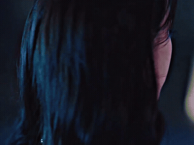 A Close Up Of A Woman 'S Face With A Black Spot On Her Forehead GIF