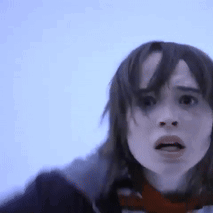 A Close Up Of A Woman 'S Face With A Blue Background GIF