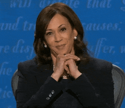 A Close Up Of A Woman 'S Face With A Blue Background That Says Pause GIF