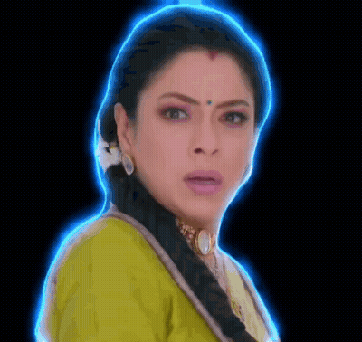 A Close Up Of A Woman 'S Face With A Blue Glow Around Her Head . GIF