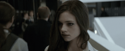 A Close Up Of A Woman 'S Face With A Blurred Background GIF