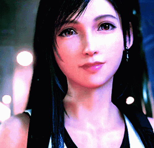 A Close Up Of A Woman 'S Face With A Blurred Background GIF