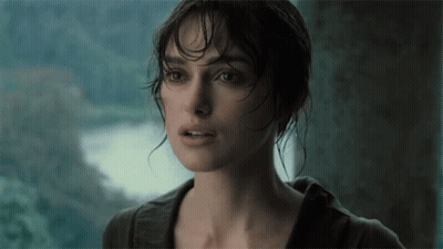 A Close Up Of A Woman 'S Face With A Blurred Background GIF