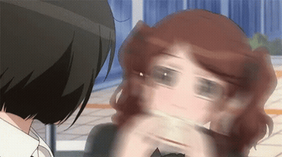A Close Up Of A Woman 'S Face With A Blurred Background GIF