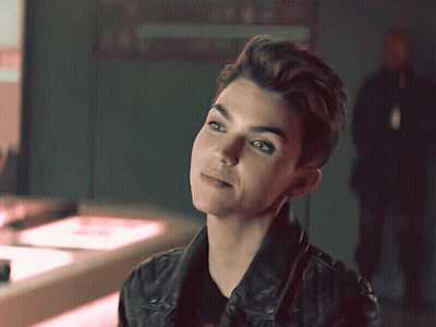 A Close Up Of A Woman 'S Face With A Blurred Background GIF