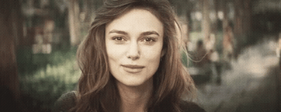 A Close Up Of A Woman 'S Face With A Blurred Background . GIF