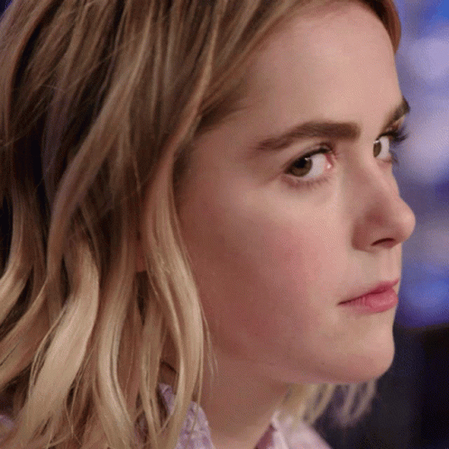 A Close Up Of A Woman 'S Face With A Brown Eye GIF