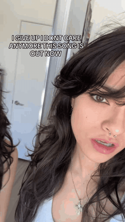 A Close Up Of A Woman 'S Face With A Caption That Says I Give Up I Don T Care Anymore GIF