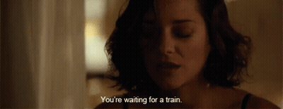 A Close Up Of A Woman 'S Face With A Caption That Says You 'Re Waiting For A Train GIF