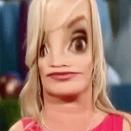 A Close Up Of A Woman 'S Face With A Cartoon Face GIF