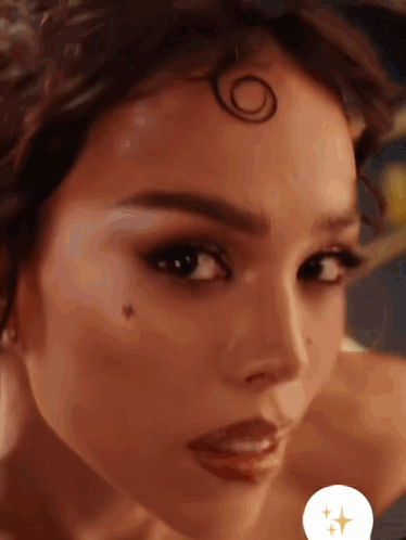 A Close Up Of A Woman 'S Face With A Circle On Her Head GIF