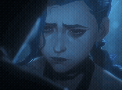 A Close Up Of A Woman 'S Face With A Dark Background GIF