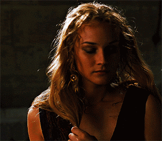 A Close Up Of A Woman 'S Face With A Dark Background GIF