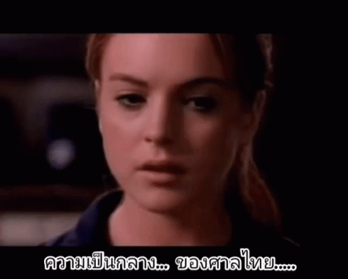 A Close Up Of A Woman 'S Face With A Foreign Language Written On The Bottom . GIF