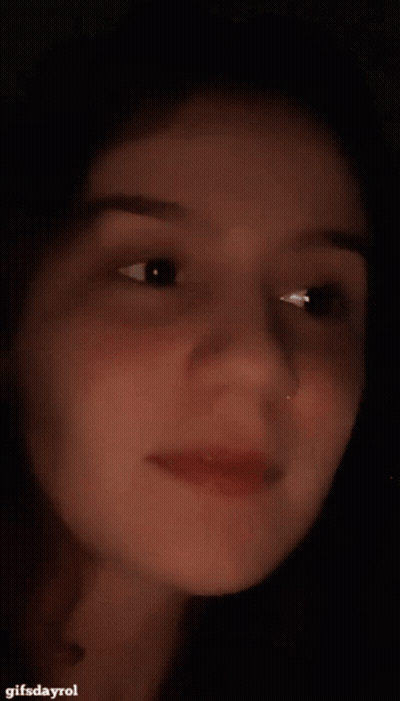 A Close Up Of A Woman 'S Face With A Gifsdayrol Watermark GIF