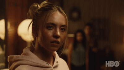A Close Up Of A Woman 'S Face With A Hbo Logo Behind Her GIF