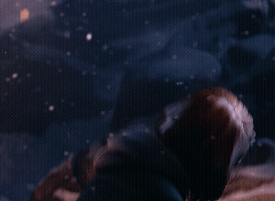 A Close Up Of A Woman 'S Face With A Hood On GIF