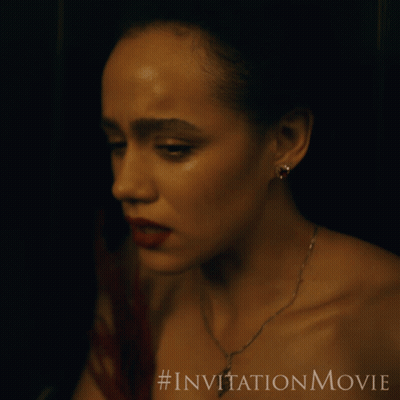 A Close Up Of A Woman 'S Face With A # Invitationmovie Written Below Her GIF