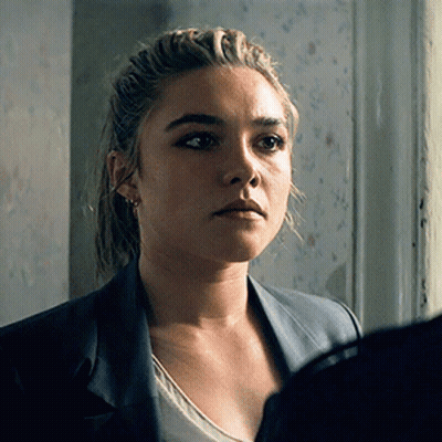 A Close Up Of A Woman 'S Face With A Jacket On GIF