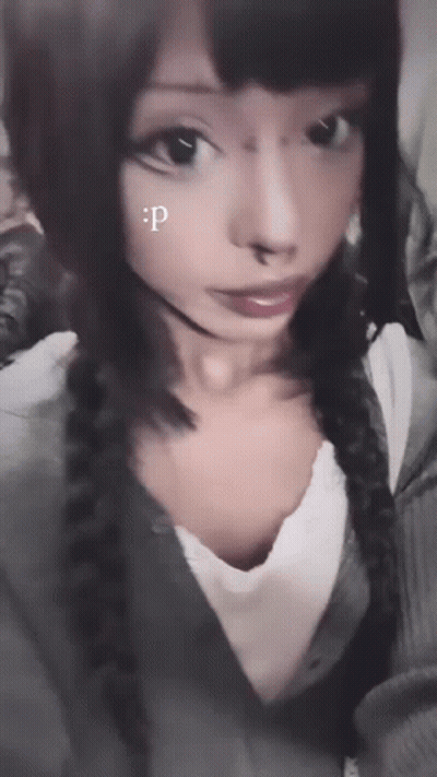 A Close Up Of A Woman 'S Face With A Letter P On Her Face GIF