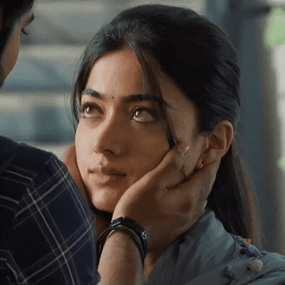 A Close Up Of A Woman 'S Face With A Man 'S Hand On Her Forehead GIF