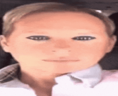 A Close Up Of A Woman 'S Face With A Mask On Her Eyes GIF