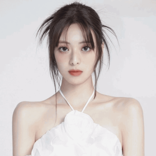 A Close Up Of A Woman 'S Face With A Messy Hairdo And Red Lips . GIF