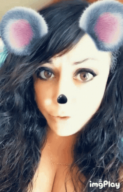 A Close Up Of A Woman 'S Face With A Mouse Mask On GIF