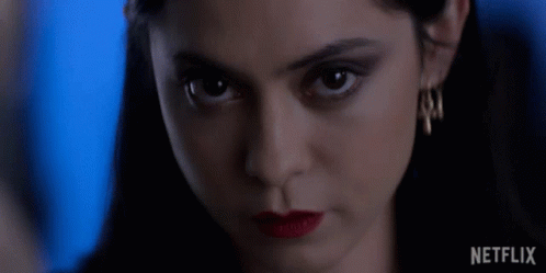 Close Up Of Woman's Face With Netflix Logo GIF