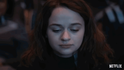 A Close Up Of A Woman 'S Face With A Netflix Logo In The Corner GIF