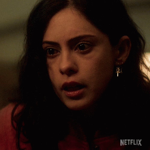 Close Up Of Woman's Face With Netflix Logo GIF