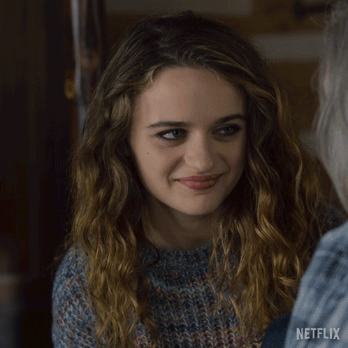 A Close Up Of A Woman 'S Face With A Netflix Logo On The Bottom GIF